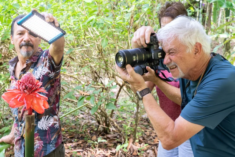 Richard Camp takes a photo of a rede-eyed tree frog.